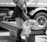 showing her bum in a short skirt in a windy Queen St, Auckland city